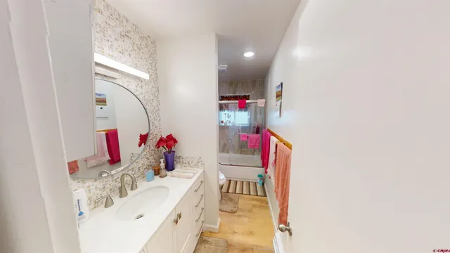 a bathroom with a bath tub and a sink