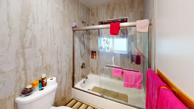 a bedroom with a bed and a walk in closet