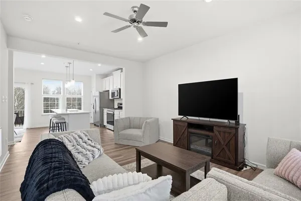 a living room with furniture and a flat screen tv