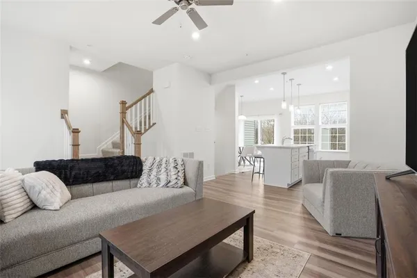 a living room with furniture rug and window