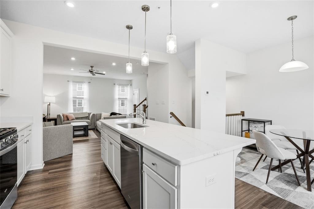 237 Truth Circle Harmony, PA 16037 - Photo 21 of 48 a large kitchen with kitchen island a stove a table a sink and chairs