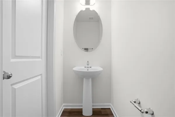 a bathroom with a sink and mirror