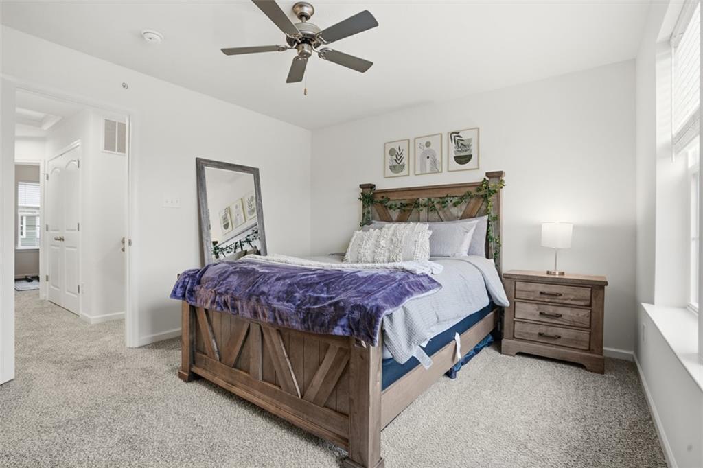 237 Truth Circle Harmony, PA 16037 - Photo 34 of 48 a bedroom with a bed and a chandelier