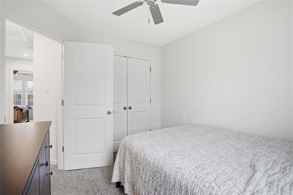 237 Truth Circle Harmony, PA 16037 - Photo 40 of 48 a bedroom with a bed and a chandelier