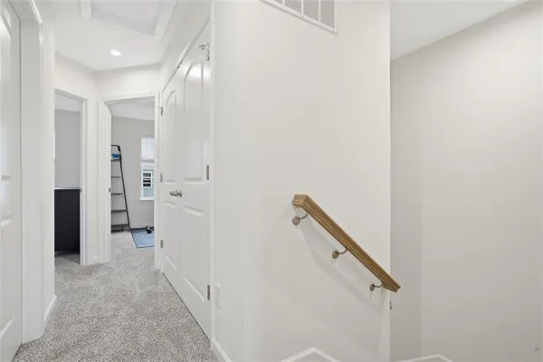 a view of a hallway with closet and entryway