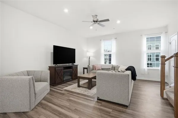 a living room with furniture and a flat screen tv