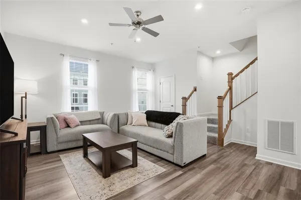 a living room with furniture and a large window