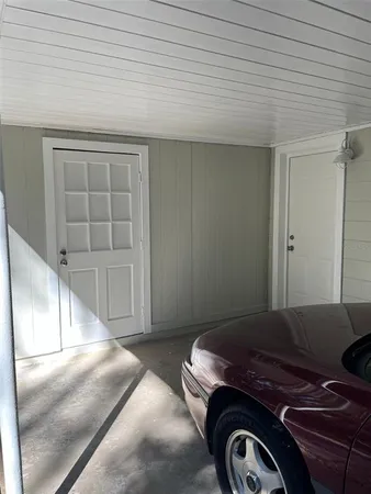 a view of a livingroom with washer and dryer