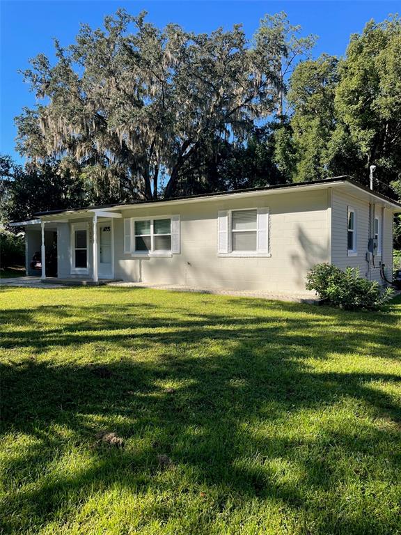 122 Northeast 37th Terrace Ocala, FL 34470 - Photo 20 of 20 a front view of house with yard and green space