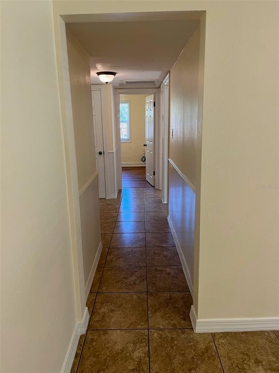122 Northeast 37th Terrace Ocala, FL 34470 - Photo 3 of 20 a view of a hallway with wooden floor