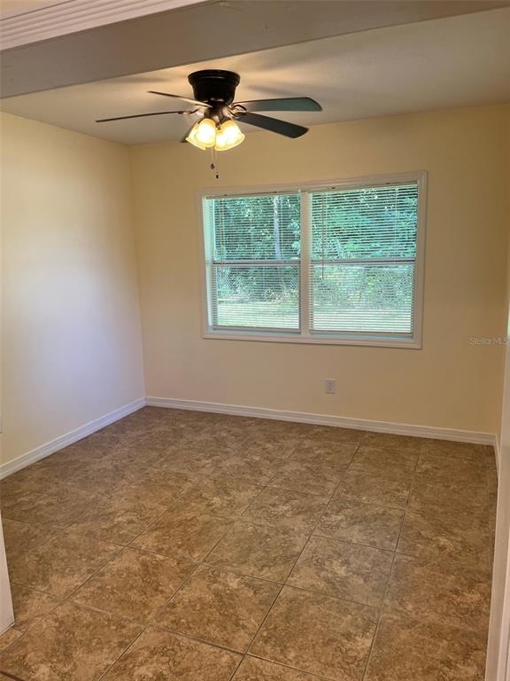 122 Northeast 37th Terrace Ocala, FL 34470 - Photo 7 of 20 an empty room with a window