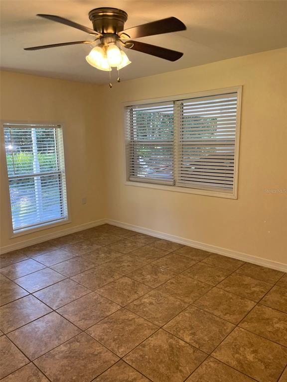 122 Northeast 37th Terrace Ocala, FL 34470 - Photo 8 of 20 a view of an empty room with a window