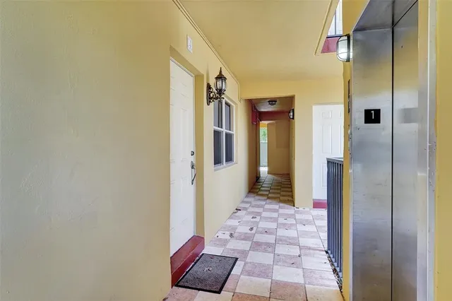a bathroom with a glass door shower