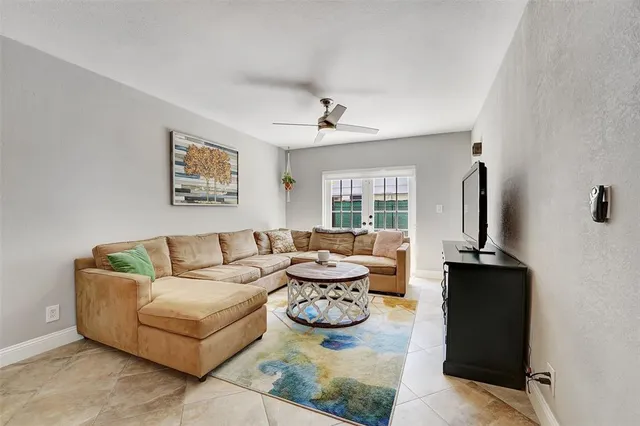 a living room with fireplace furniture and a flat screen tv