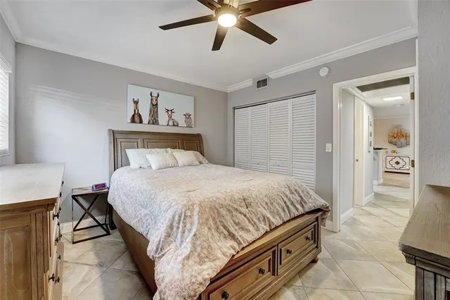 a kitchen with a refrigerator and a stove top oven