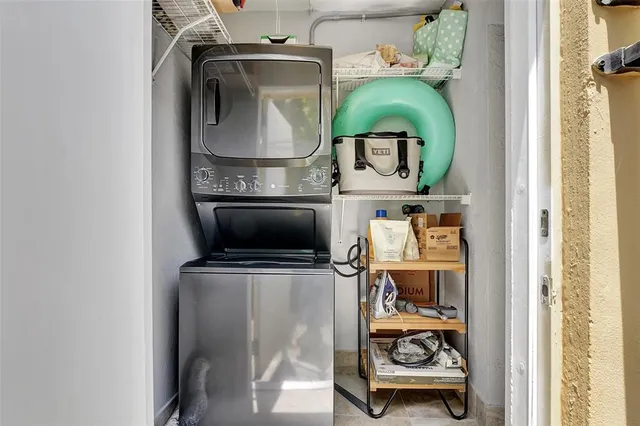 a view of a pathway of a building with wooden fence