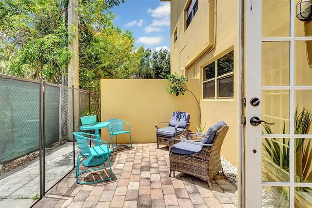 a view of a brick house with a large windows