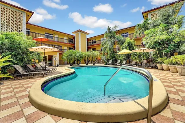 a view of a swimming pool with a patio