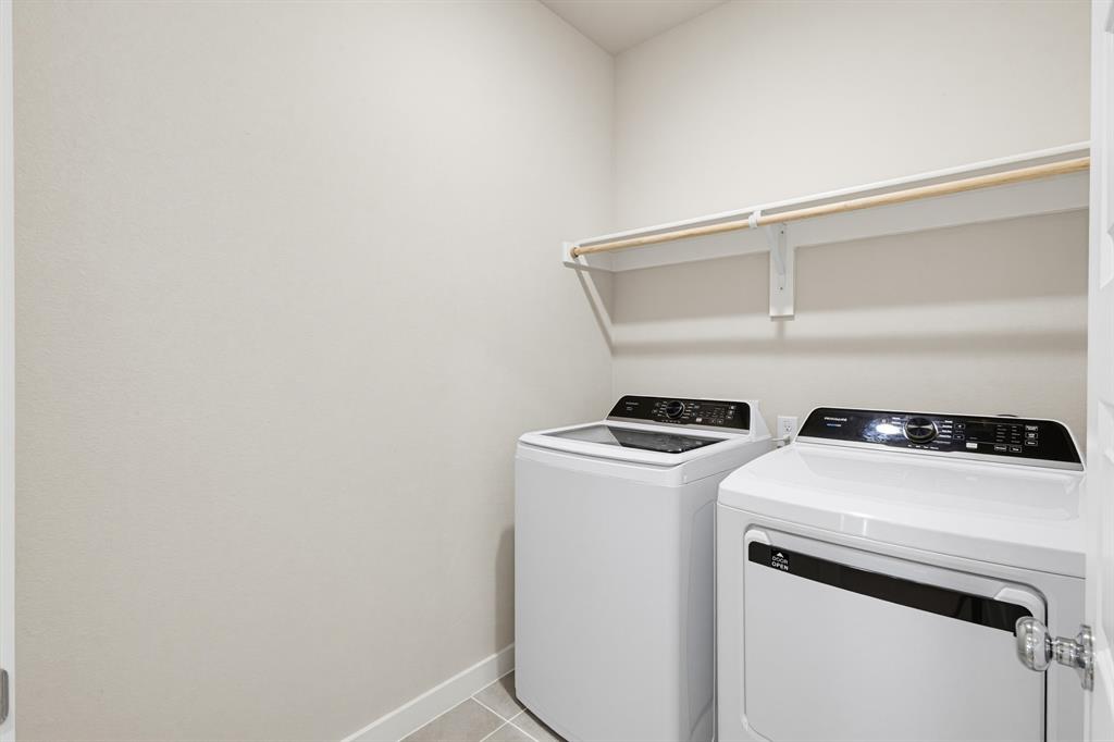2108 Mossfield Lane Forney, TX 75126 - Photo 19 of 28 Dedicated laundry area featuring a built-in shelf and hanging rod