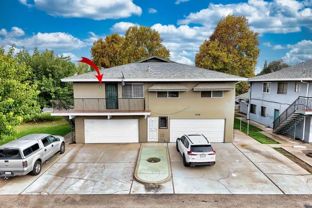 a car parked in front of a house