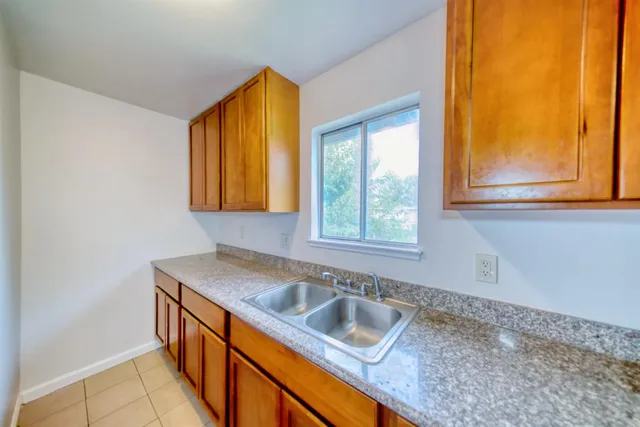 a kitchen that has a sink and a window