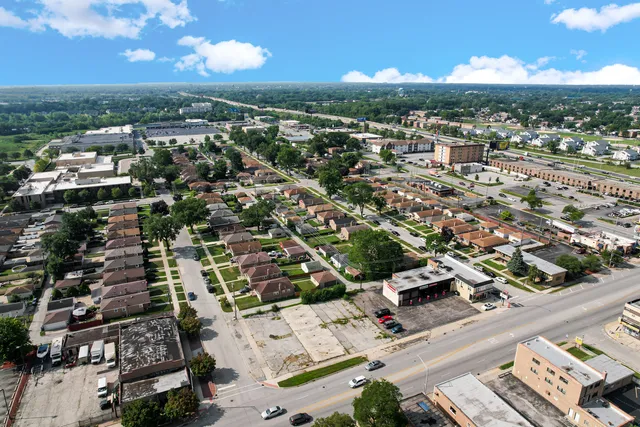 an aerial view of residential building with parking
