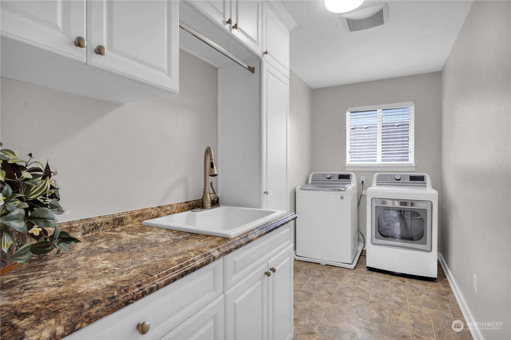 3926 216th Place Southeast Bothell, WA 98021 - Photo 23 of 31 a utility room with sink dryer and washer