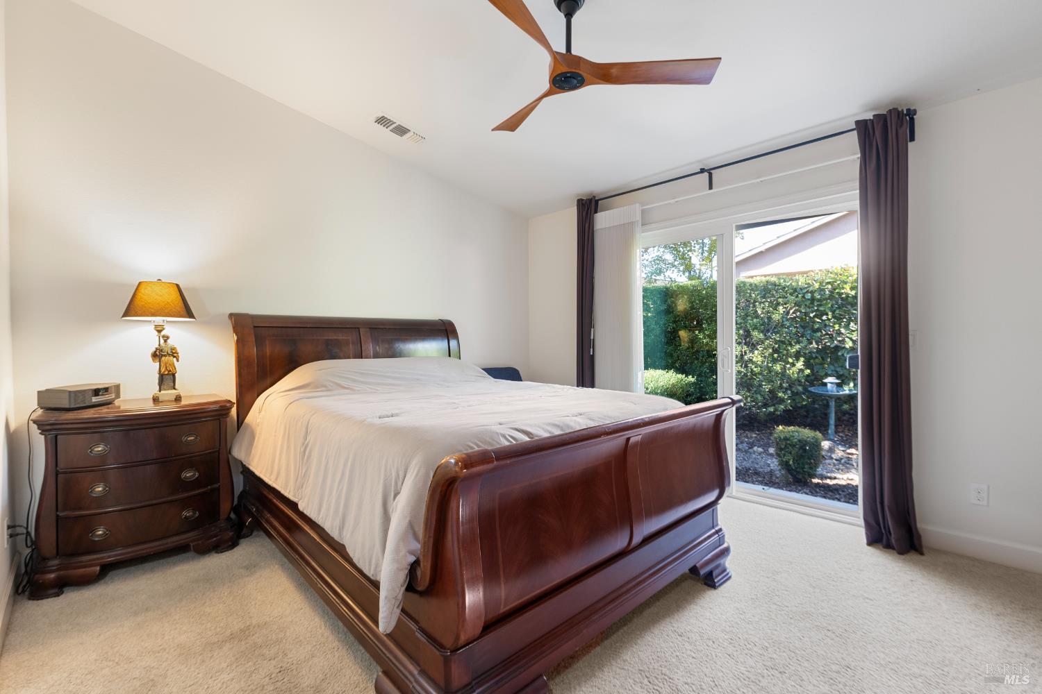 319 Birch Ridge Drive Rio Vista, CA 94571 - Photo 13 of 28 a bed sitting in a bedroom next to a window