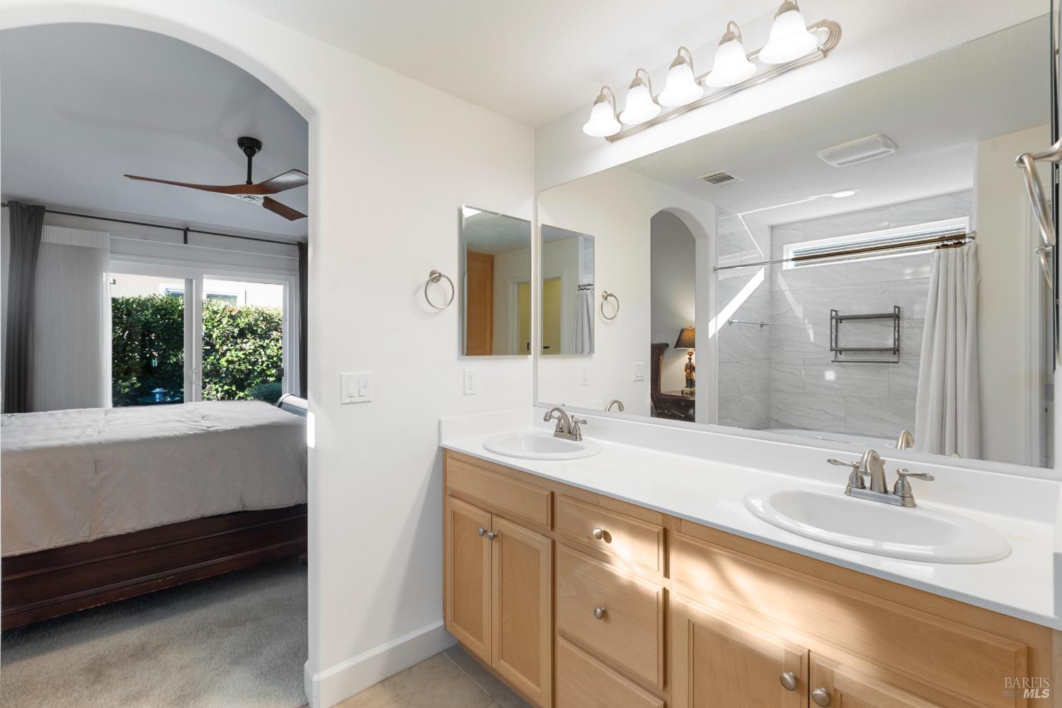 319 Birch Ridge Drive Rio Vista, CA 94571 - Photo 16 of 28 a bathroom with double vanity sinks a vanity a lamp and a mirror