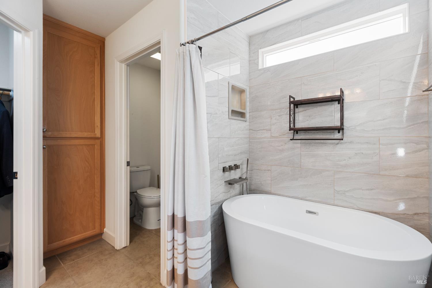 319 Birch Ridge Drive Rio Vista, CA 94571 - Photo 17 of 28 a bathroom with a tub a window and a shower
