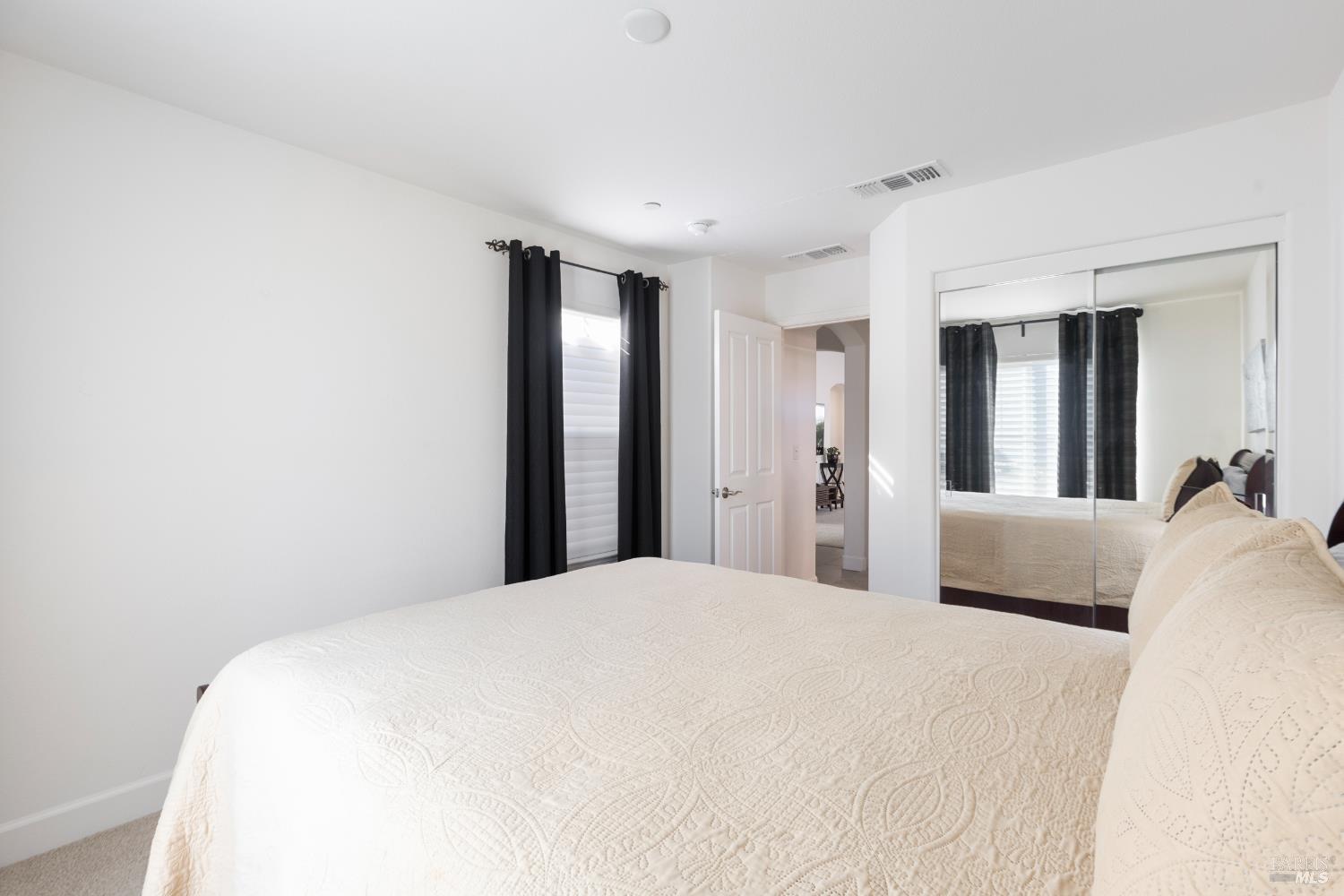 319 Birch Ridge Drive Rio Vista, CA 94571 - Photo 20 of 28 a bedroom with a large bed and a large mirror