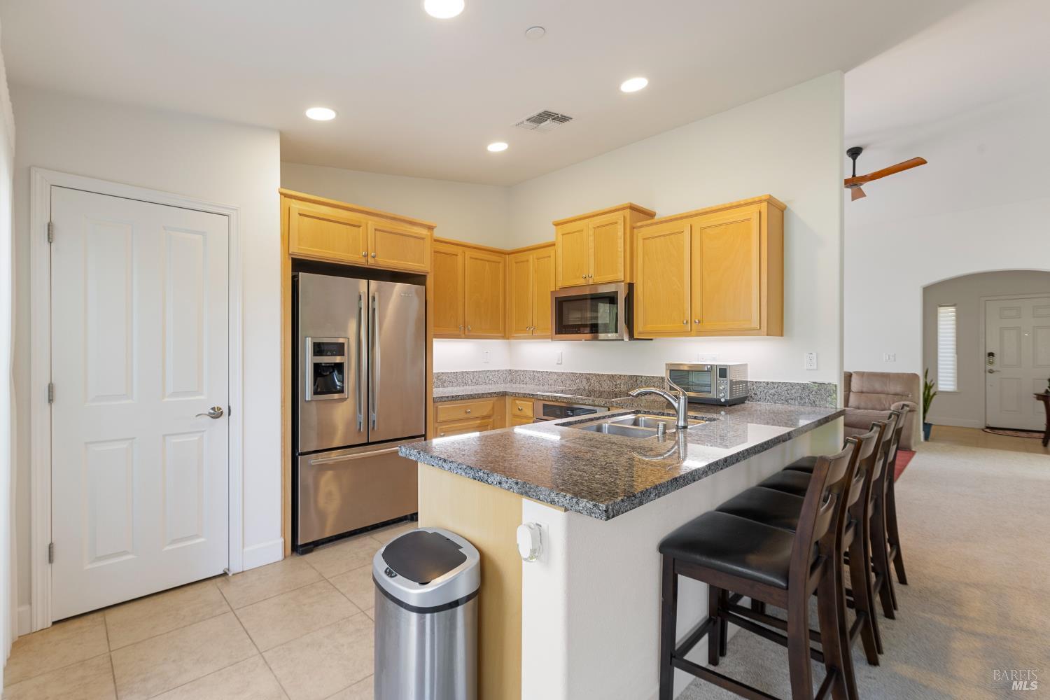 319 Birch Ridge Drive Rio Vista, CA 94571 - Photo 10 of 28 a kitchen with stainless steel appliances granite countertop a sink and a refrigerator