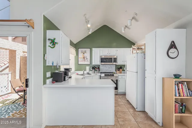 a kitchen with stainless steel appliances a stove sink and microwave