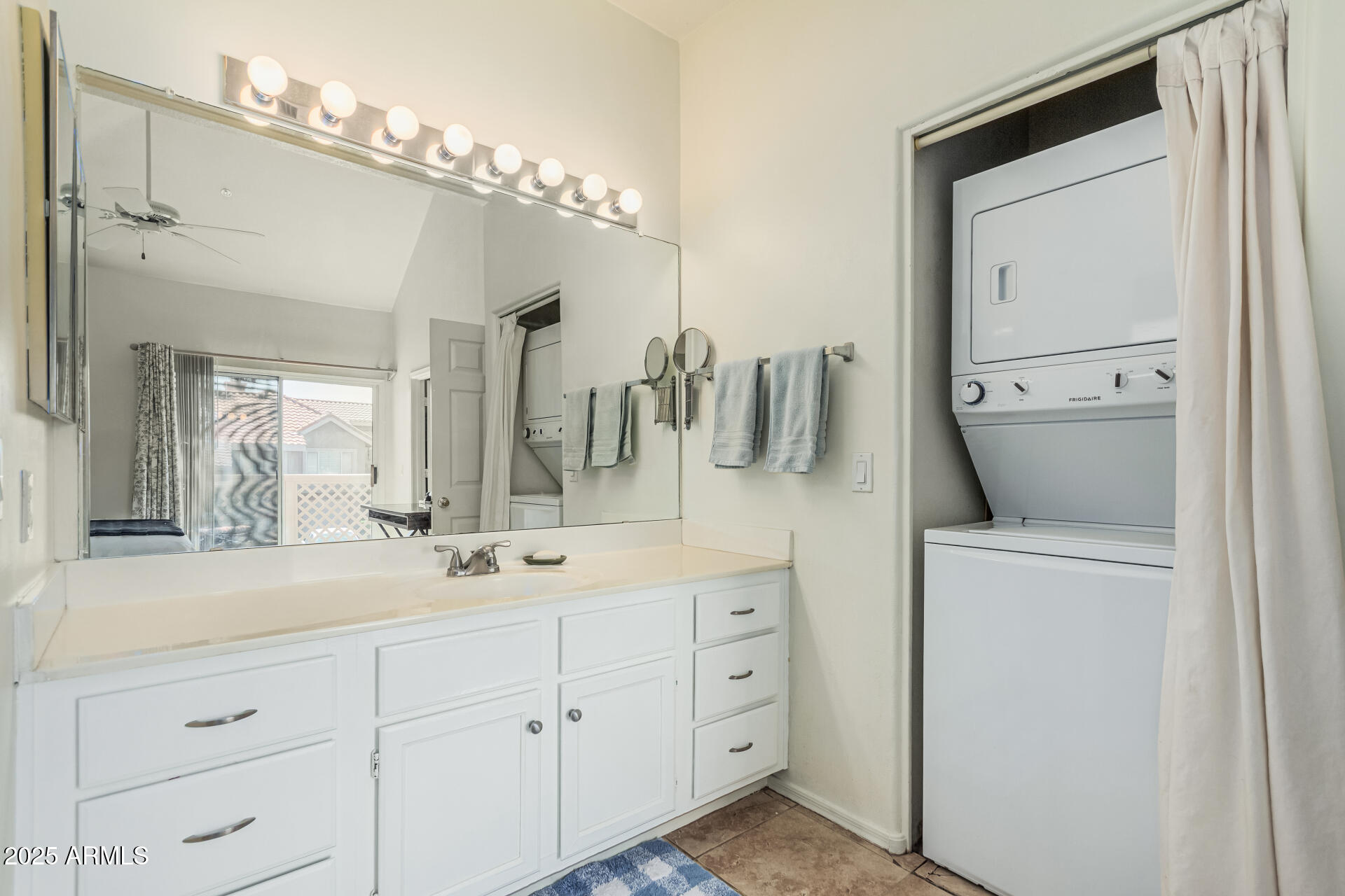 1633 East Lakeside Drive, Unit 166 Gilbert, AZ 85234 - Photo 19 of 43 a bathroom with a double vanity sink and a mirror