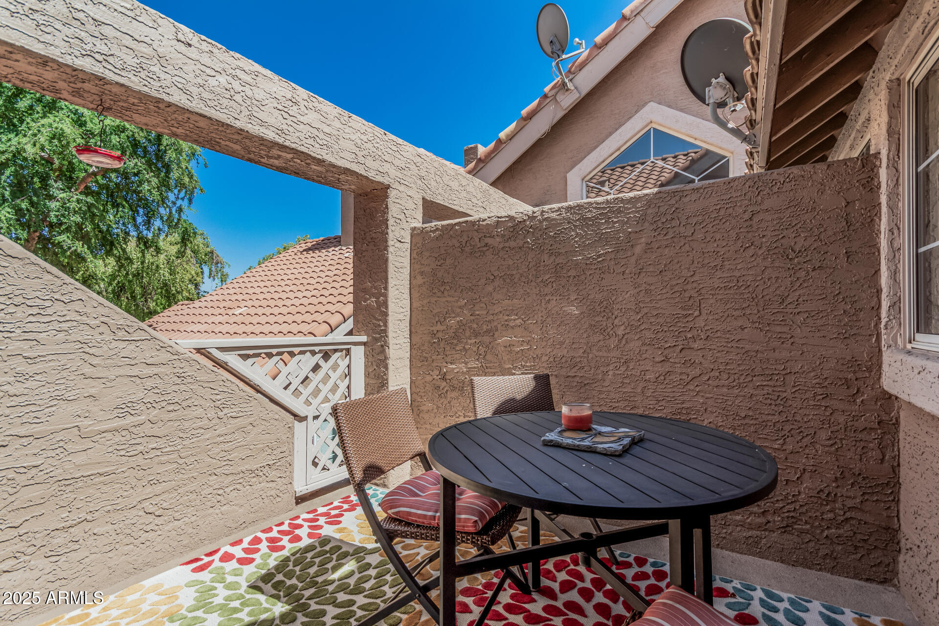 1633 East Lakeside Drive, Unit 166 Gilbert, AZ 85234 - Photo 23 of 43 a backyard of a house with table and chairs
