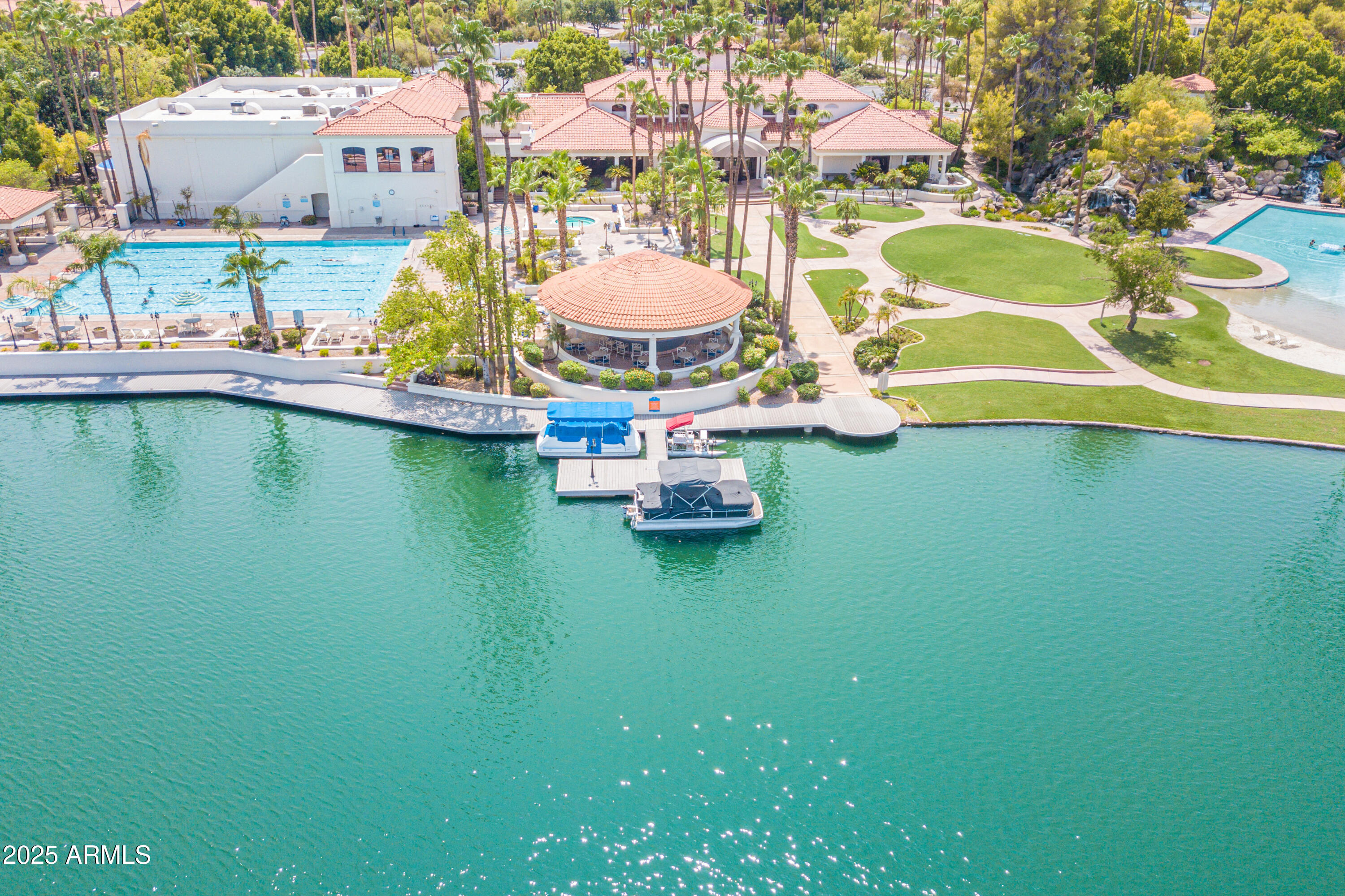 1633 East Lakeside Drive, Unit 166 Gilbert, AZ 85234 - Photo 28 of 43 an aerial view of residential houses with outdoor space