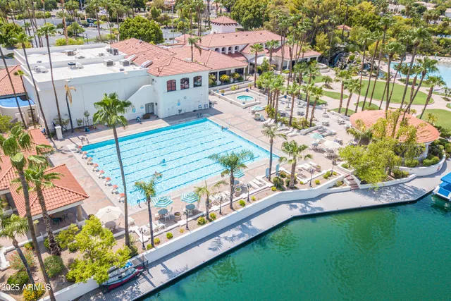 a view of a swimming pool with a yard