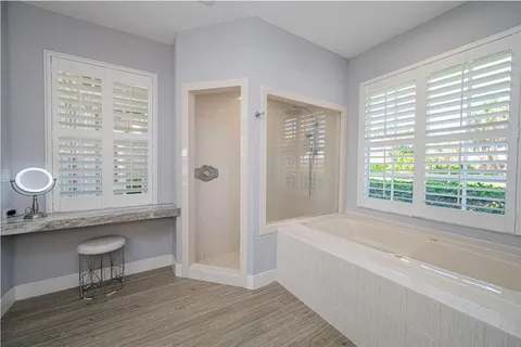 a bedroom with a bed and a table