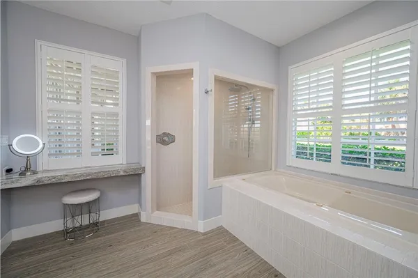 a bedroom with a bed and a table