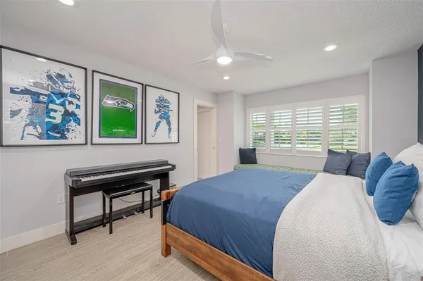 a bathroom with a granite countertop sink a toilet and a mirror