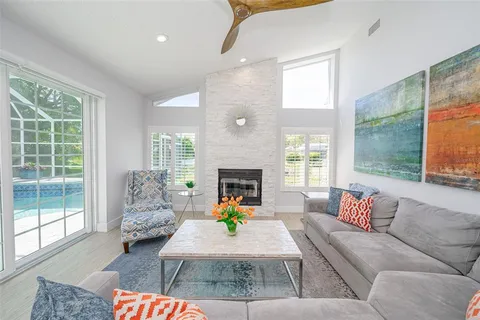 a kitchen with stainless steel appliances granite countertop a sink a stove and a refrigerator