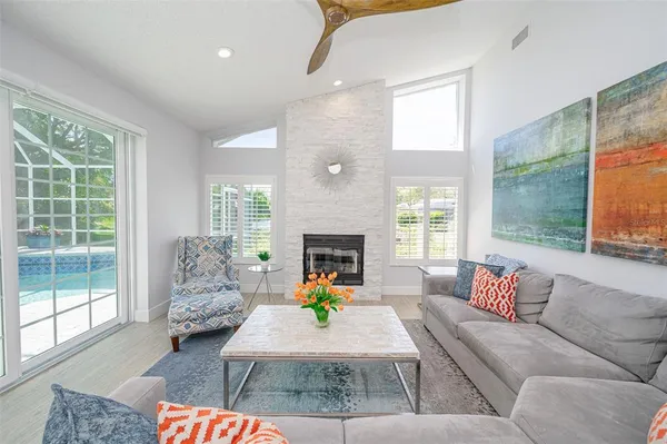 a kitchen with stainless steel appliances granite countertop a sink a stove and a refrigerator