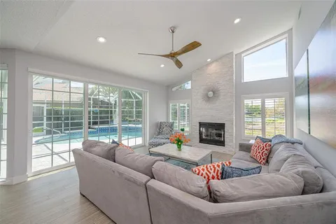 a large kitchen with stainless steel appliances kitchen island granite countertop a stove a sink a dining table and chairs