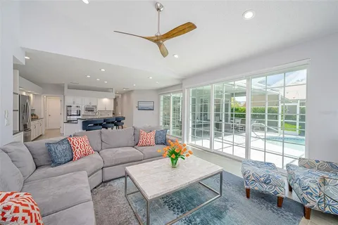 a kitchen with granite countertop white cabinets white stainless steel appliances and sink