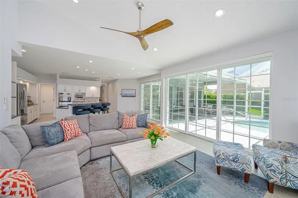 a kitchen with granite countertop white cabinets white stainless steel appliances and sink