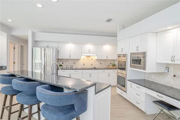 a view of a livingroom with an empty space and a projector