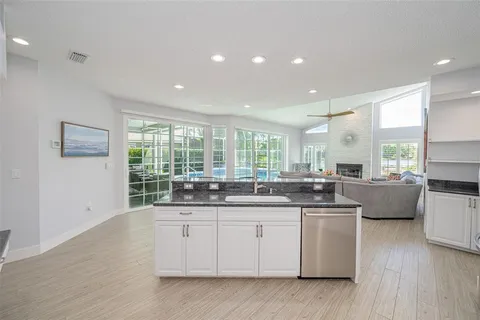 a view of empty room with wooden floor and floor to ceiling window