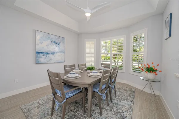a view of a dining room with furniture and window
