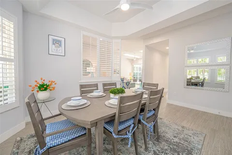 a view of a dining room with furniture and window