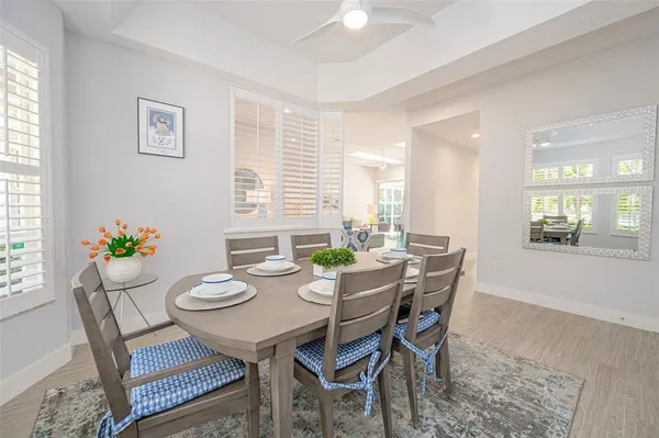 a view of a dining room with furniture and window